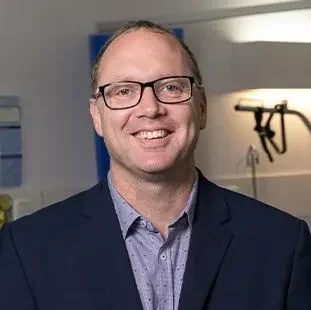PROFESSOR BRETT MITCHELL